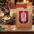 Java Junkies Eggnog Flavored Coffee. Large mug of Eggnog coffee with whipped cream, a cinnamon stick and a holiday background.