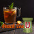 A large glass mug filled with iced peach tea garnished with fresh peach slices and mint leaves, sitting on a wooden board next to a green tea pouch.