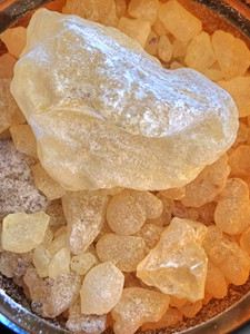 2 ounce, amber, glass jar with white copal resin pieces in it 2 ounce, amber, glass jar with white copal resin pieces in it