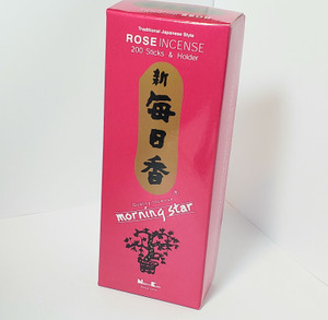 Morning Star Rose 200 Stick incense, front view. Pink box with Japanese characters in black on gold background, down middle of box. Morning Star Rose 200 Stick incense, front view. Pink box with Japanese characters in black on gold background, down middle of box.