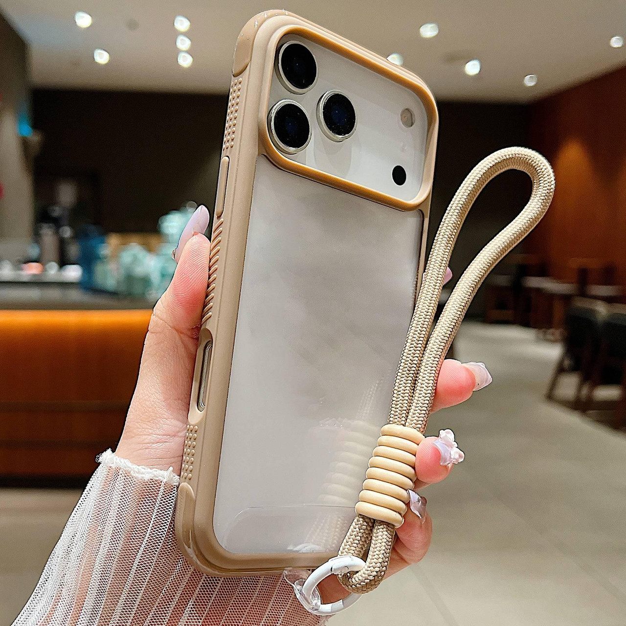 iPhone 17 Pro Max Solid Color Edge Transparency Acrylic TPU Phone Case with Wrist Strap - Brown iPhone 17 Pro Max Solid Color Edge Transparency Acrylic TPU Phone Case with Wrist Strap - Brown