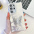 Samsung Galaxy S25 Ultra 5G Plating Glitter Texture Butterfly Holder TPU Phone Case with Lens Film - White Feathers