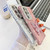 Samsung Galaxy S25 5G Plating Glitter Lens Film Texture Butterfly Holder Wristband Phone Case - Pink Shell Pattern