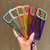 iPhone 17 Pro Color Contrast Lens Frame Transparent TPU Phone Case with Lanyard - Purple+Green