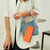 iPhone 17 Embossed Heart Cat Leather Phone Case with Hand Strap - Orange iPhone 17 Embossed Heart Cat Leather Phone Case with Hand Strap - Orange