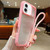 iPhone 17 Solid Color Edge Transparency Acrylic TPU Phone Case with Wrist Strap - Pink