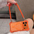 iPhone 17 Pro Max Drone-Style Four-Corner Shockproof Magnetic Acrylic Phone Case with Long and Short Lanyard - Orange