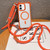 iPhone 17 Drone-Style Four-Corner Shockproof Magnetic Acrylic Phone Case with Long and Short Lanyard - Orange