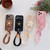 iPhone 17 Floral Holder TPU Phone Case with PU Buckle Lanyard - Coffee