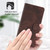 iPhone 17 Skin-feel Embossed Leather Phone Case - Brown