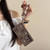 Samsung Galaxy A16 5G Soft Silicone 3D Bowknot Pearl Phone Case with Beaded Wrist Strap - Coffee