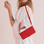 Samsung Galaxy S26 Skin Feel Heart Embossed Leather Phone Case with Long Lanyard - Red