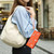 iPhone 17e / 16e ZS01 Double-Layer Heart Floral Vegan Leather Phone Case with Wrist Strap - Orange