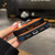 iPhone 18 Pro / 17 Pro Color Blocking Leather Texture Shockproof Magnetic Phone Case - Black Orange