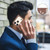 iPhone 18 Pro / 17 Pro Splicing Color Hollow Flower Pattern RFID Leather Phone Case - Brown