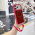 iPhone 18 Pro Color Contrast Magnetic Phone Case with Wrist Strap - Red