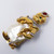 Kenneth Jay Lane Smiling Genie Crystal Pin in Gold