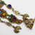 Vintage Czech Dangling Ornate Brooch with Crystals and Floral Enameling in Gold Tone