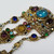 Vintage Czech Dangling Ornate Brooch with Crystals and Floral Enameling in Gold Tone