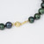 Tahitian Green Pearl Strand Necklace with 14 Karat Yellow Gold Accents and Clasp