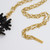 Oscar de la Renta Embellished Black Crystal Coral Motif Pendant on Gold Chain