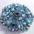 Aurora Borealis Crystal Round Abstract Flower Motif Brooch in Silver, mid 1900s