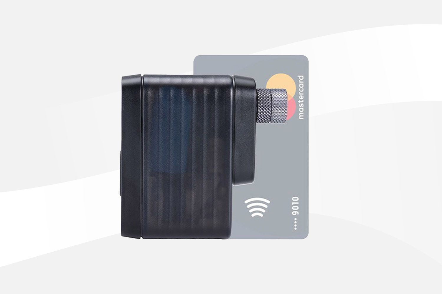 BBB Cycling BarBank compact electric bike pump displayed in front of a credit card to showcase its ultra-small, pocket-sized design.