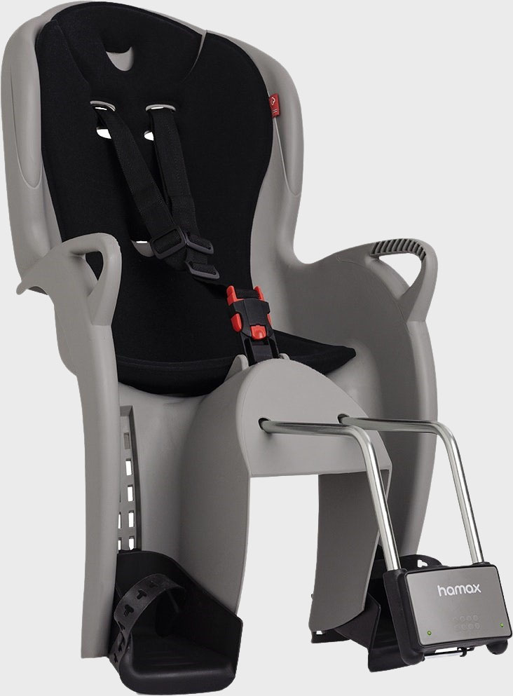 Hamax child bike seat with adjustable harness and footrests for safety and comfort.