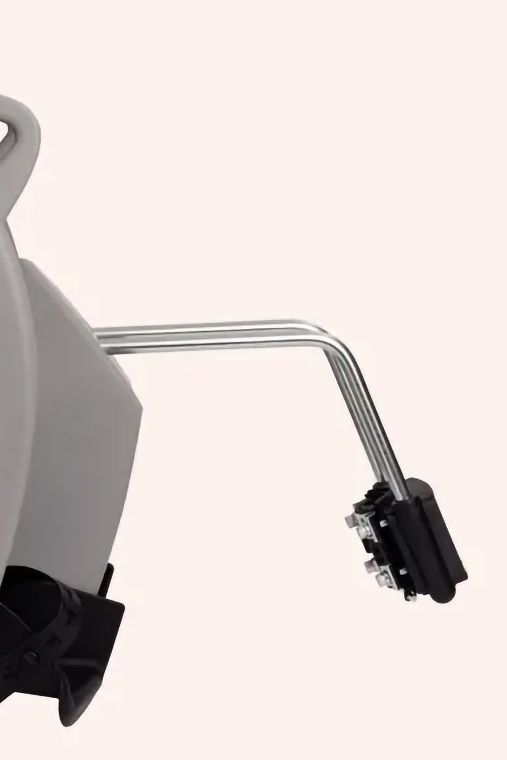 Close-up of Hamax Kiss frame-mounted seat showing free-hanging steel hoop bracket for natural suspension