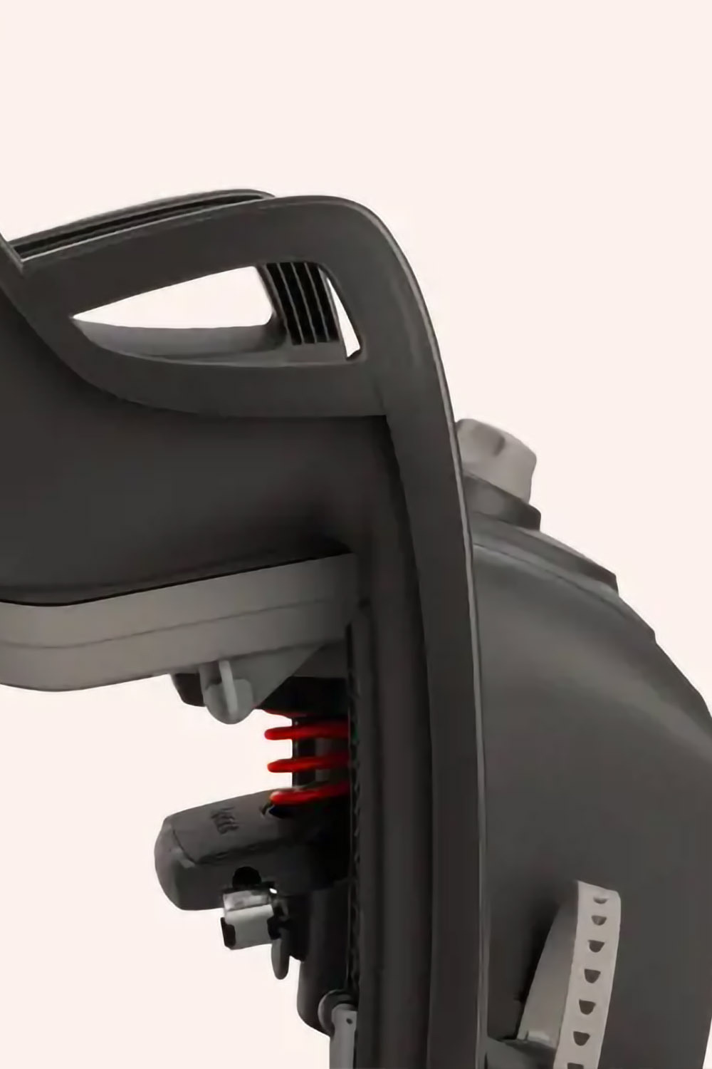 Close-up of Hamax Zenith Relax rack-mounted bike seat showing built-in suspension system for spine protection