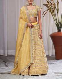 Yellow  color Silk Fabric Lehenga Choli