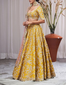 Yellow color Silk Fabric Lehenga Choli