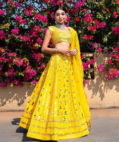 Yellow color Silk Fabric Lehenga Choli