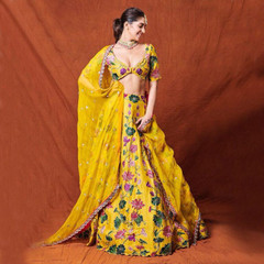 Yellow color Silk Fabric Lehenga Choli