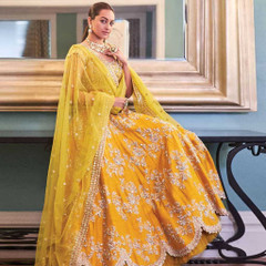 Yellow color Silk Fabric Lehenga Choli