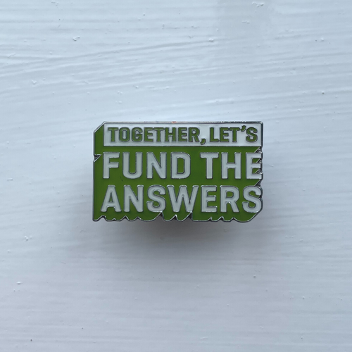 TYAC #FundTheAnswers pin badge (green)