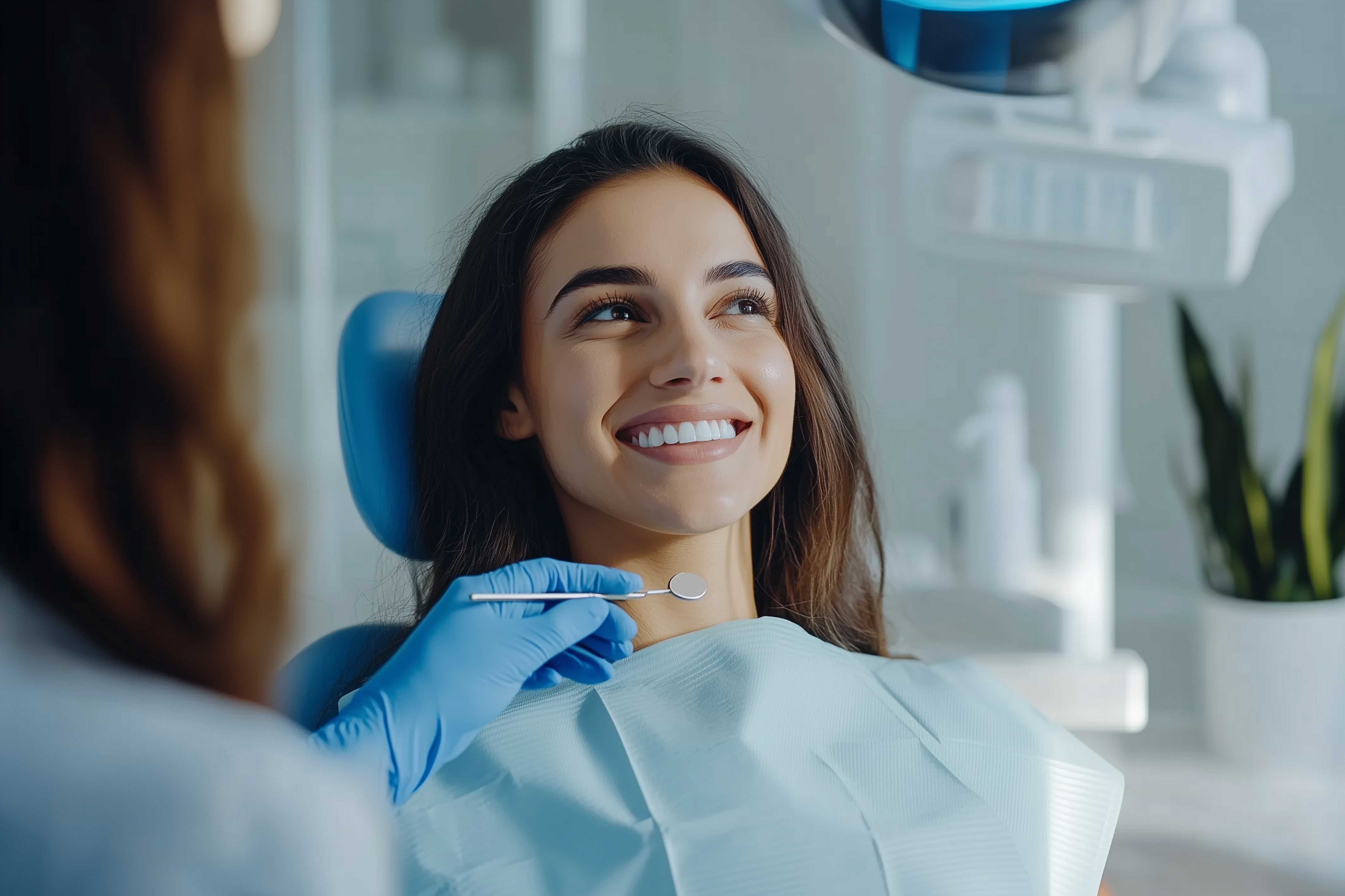 Woman smiling as she is about to have her teeth cleaned