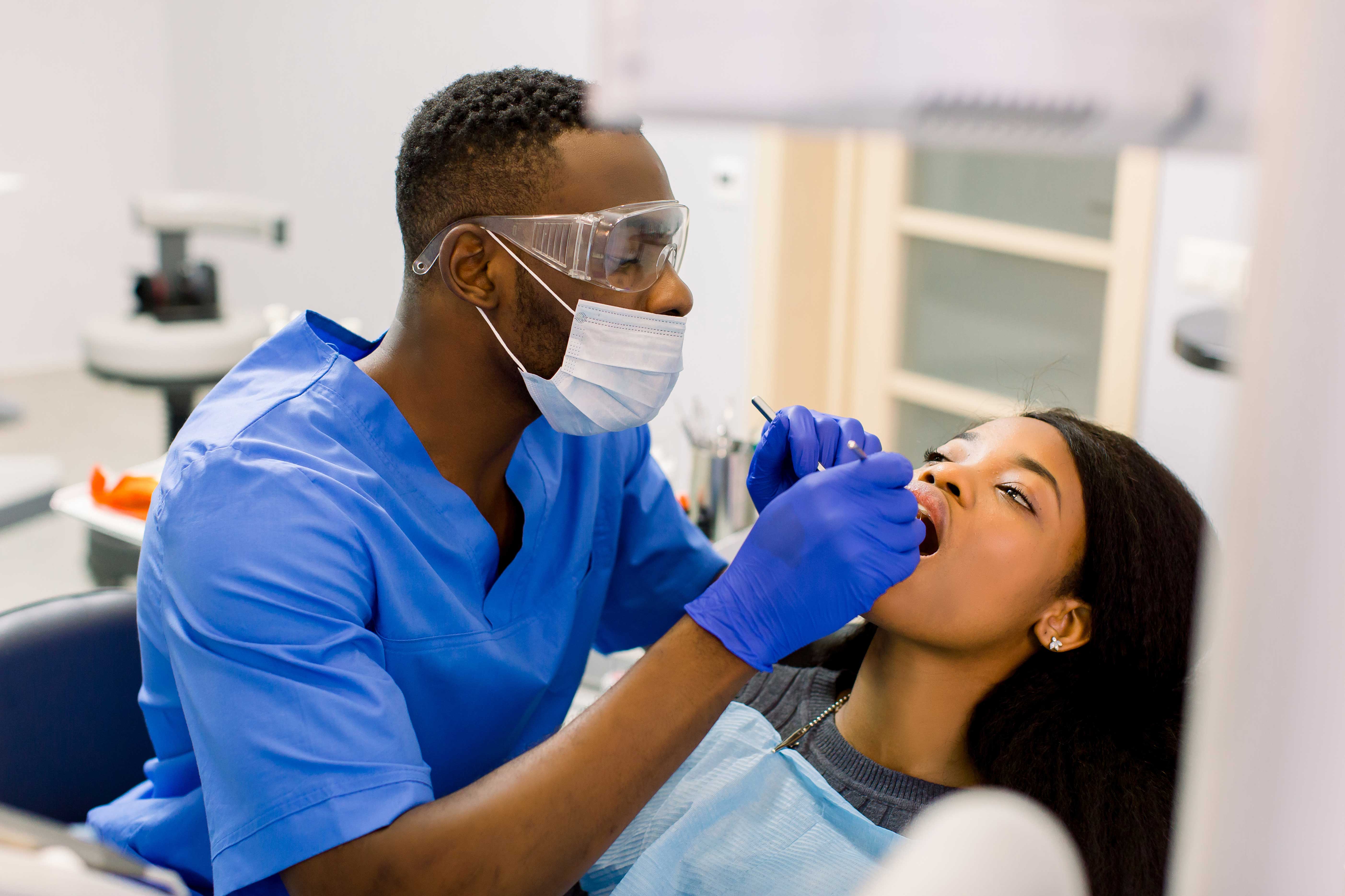 Dentist performing a dental exam on a patient