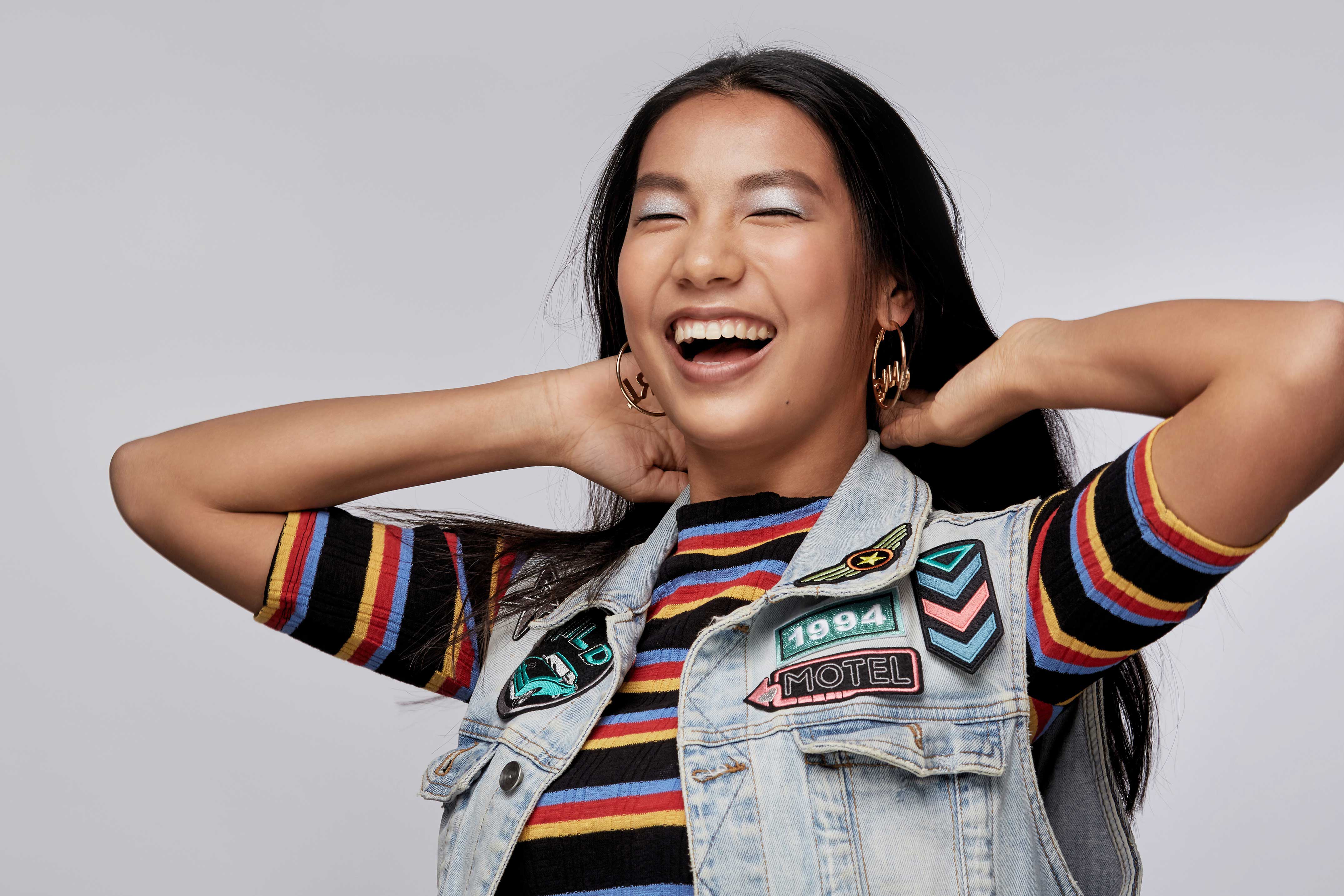 Woman smiling and showing off her healthy, clean teeth