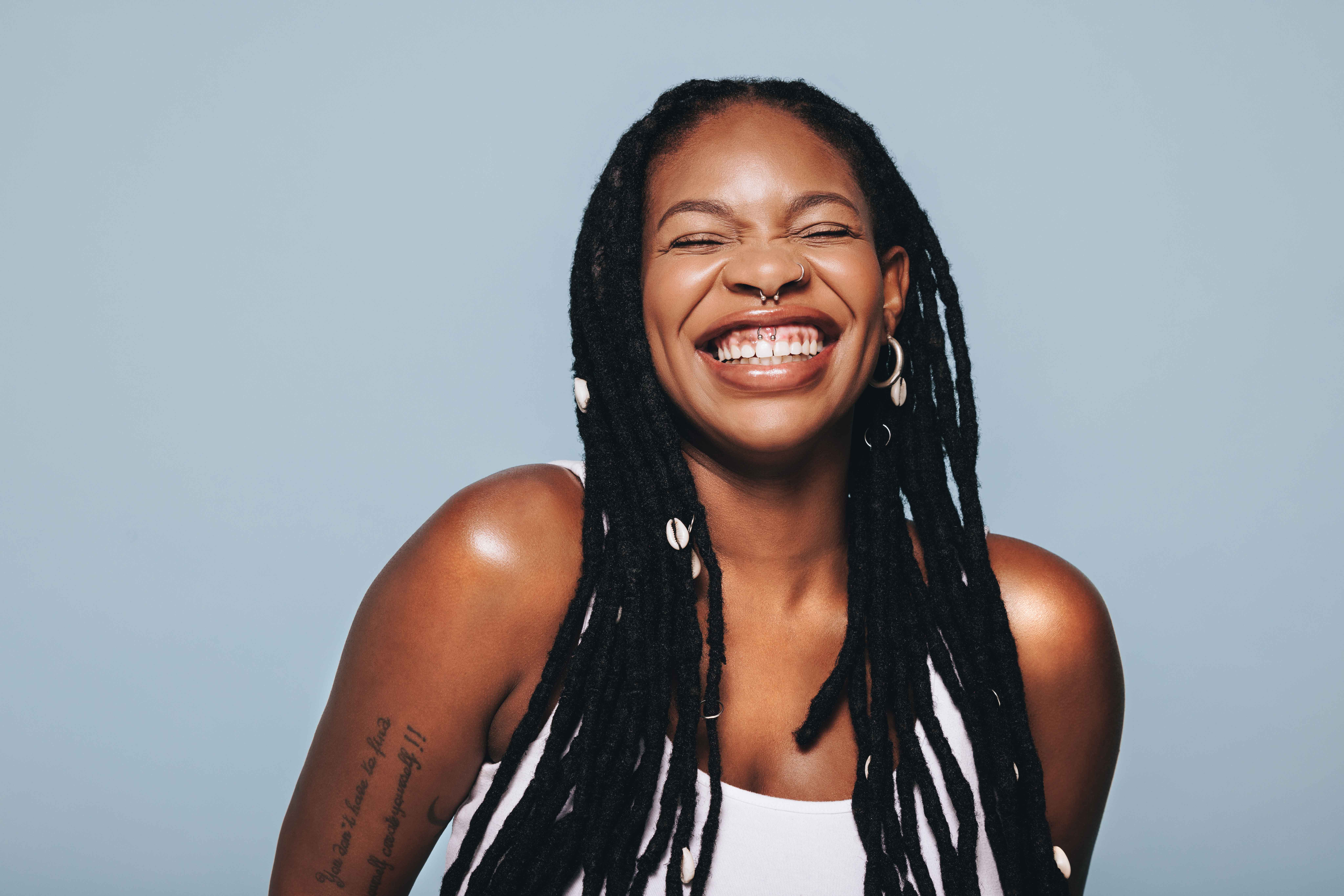 Smiling woman showing off her white teeth Banner Image Smiling woman showing off her white teeth