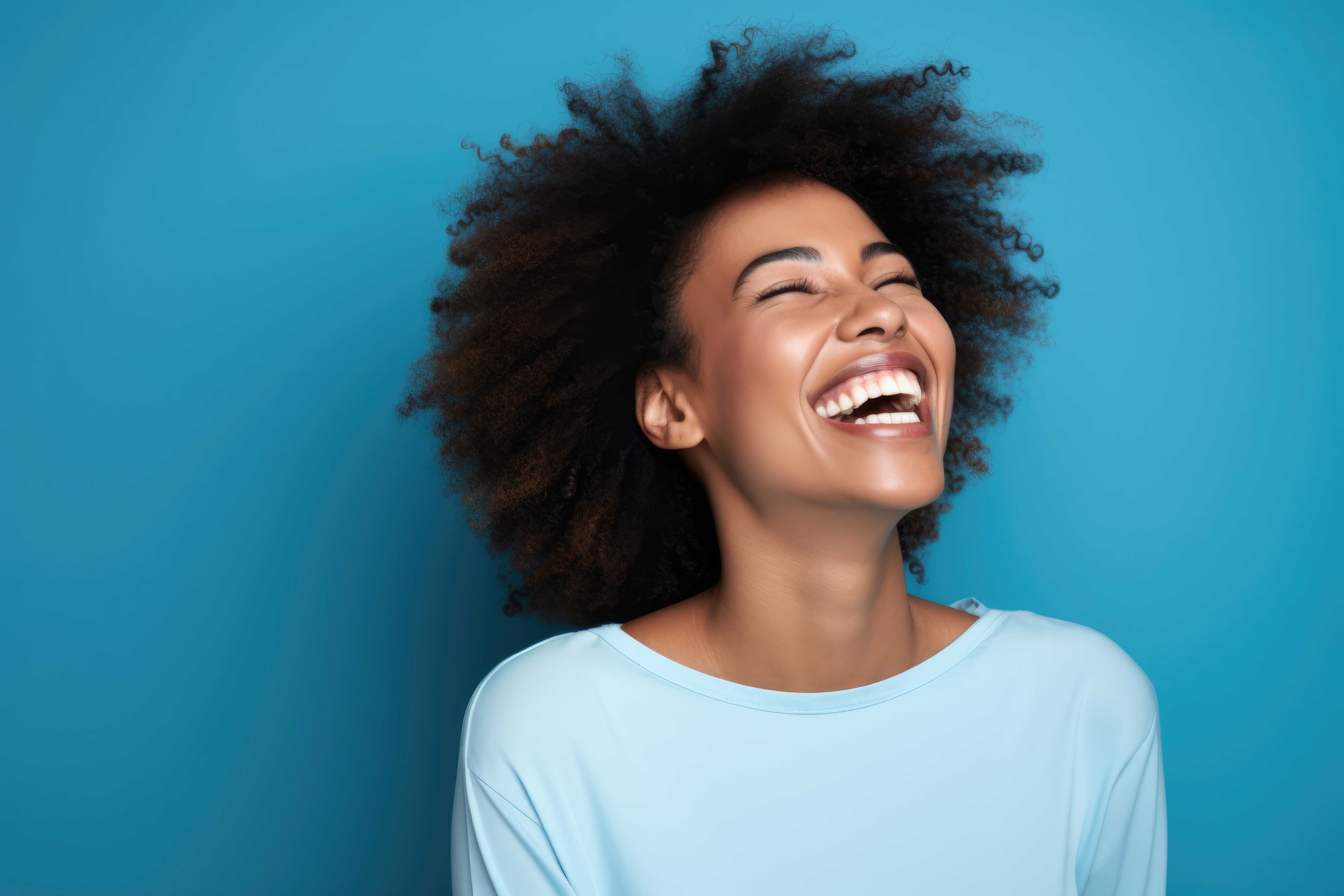 Woman laughing with her head tilted up