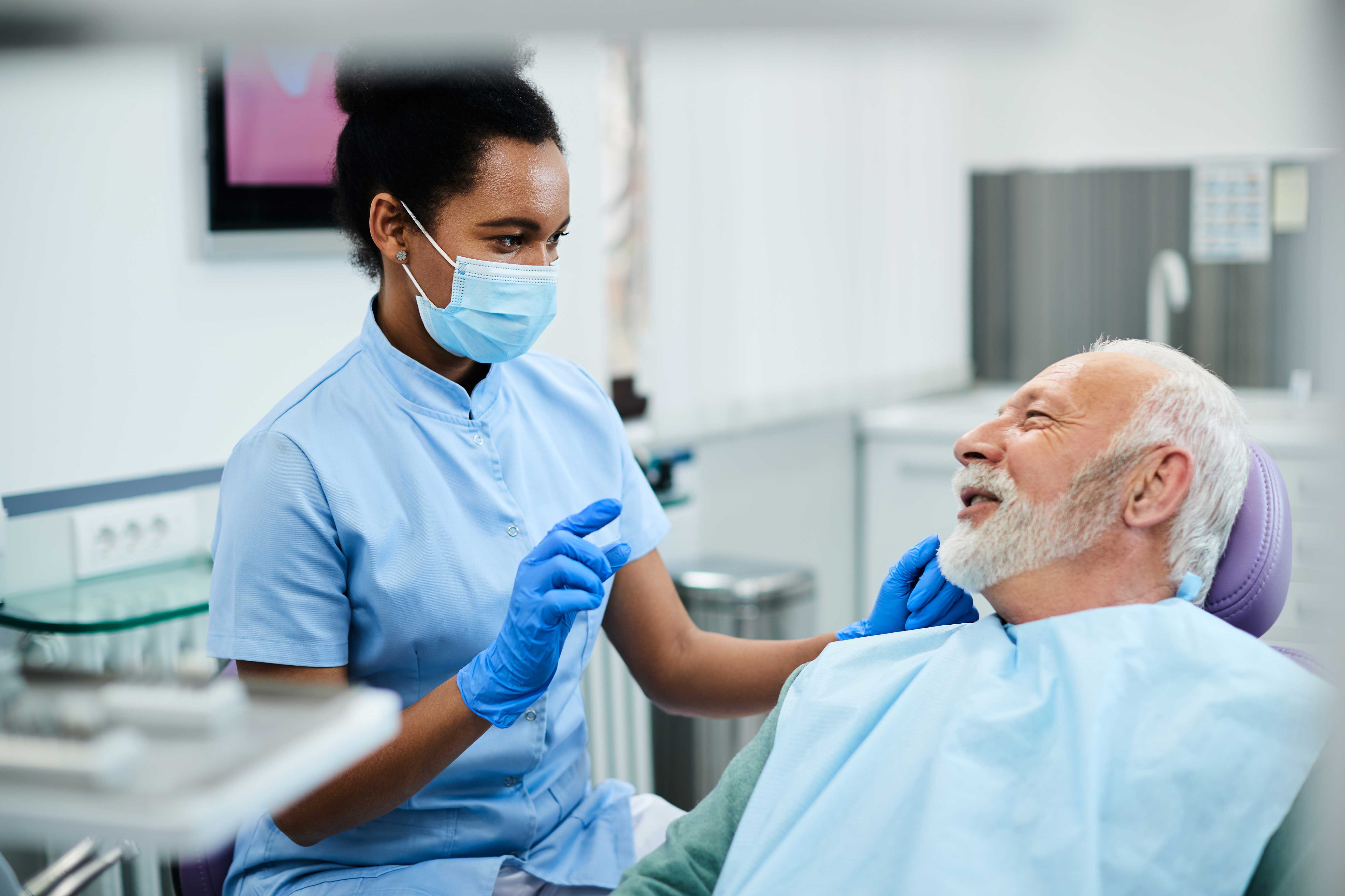 Dentist preparing to examine a patient