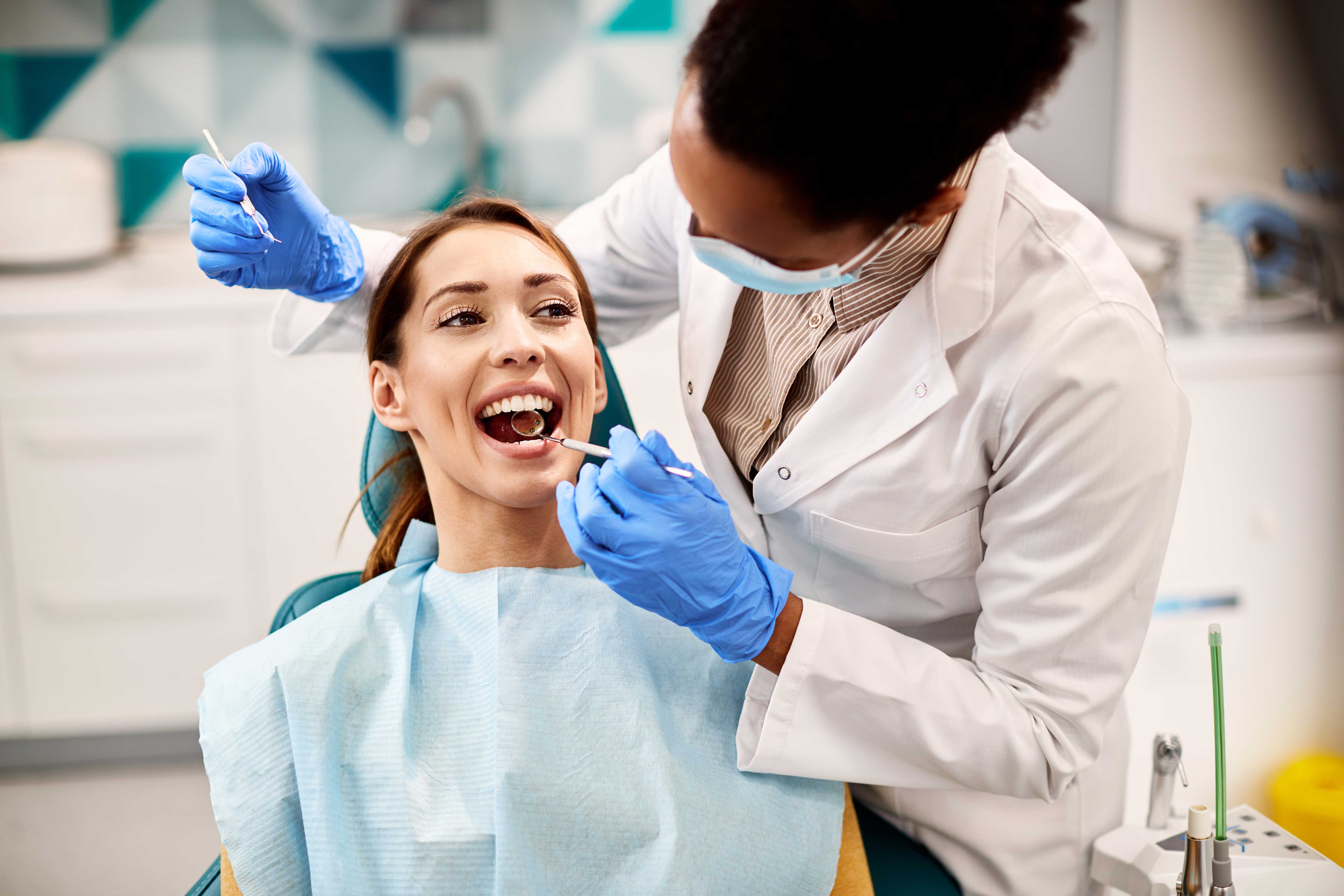 Woman visiting dentist to have a cavity treated