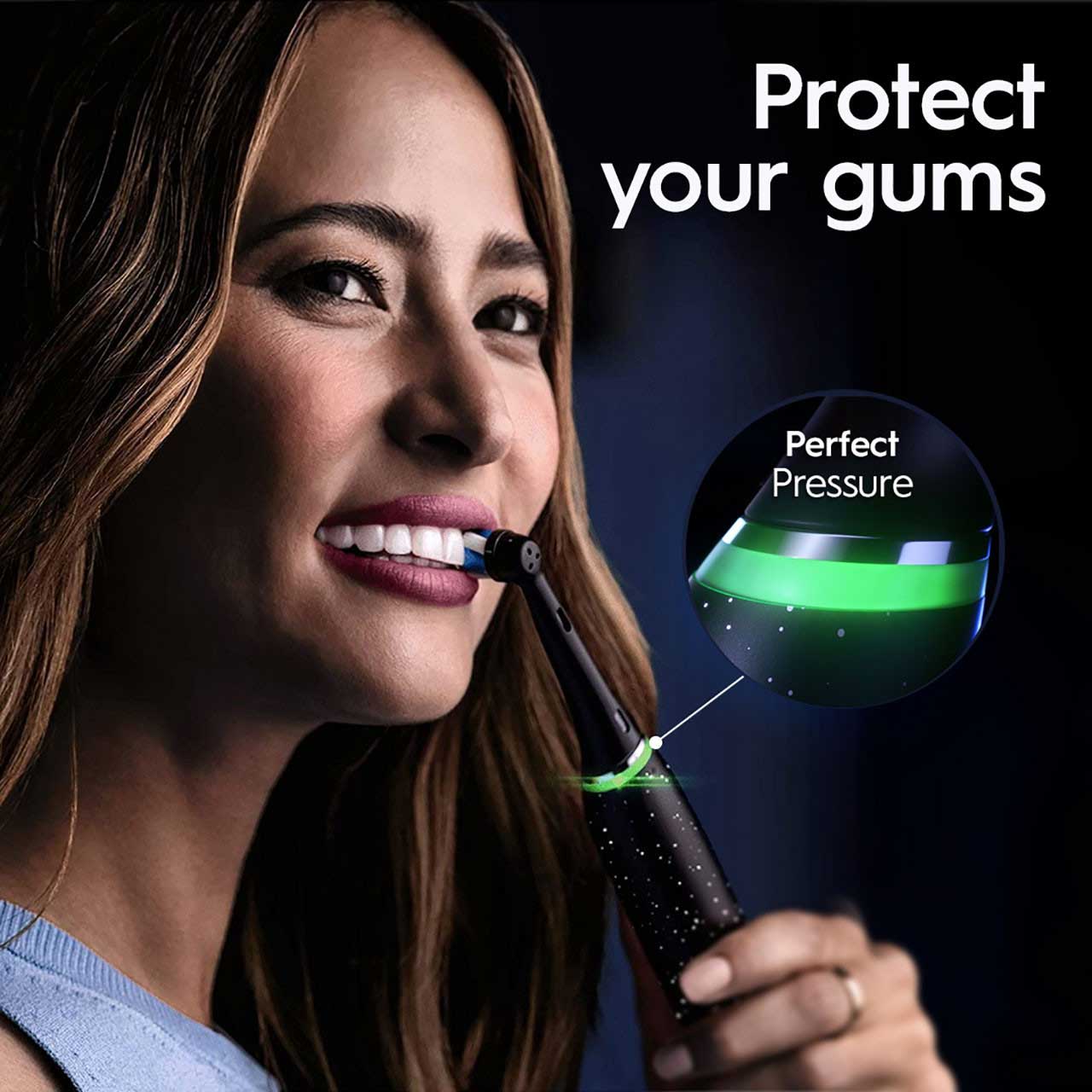 Woman brushing her teeth with an Oral-B iO Series Electric Toothbrush