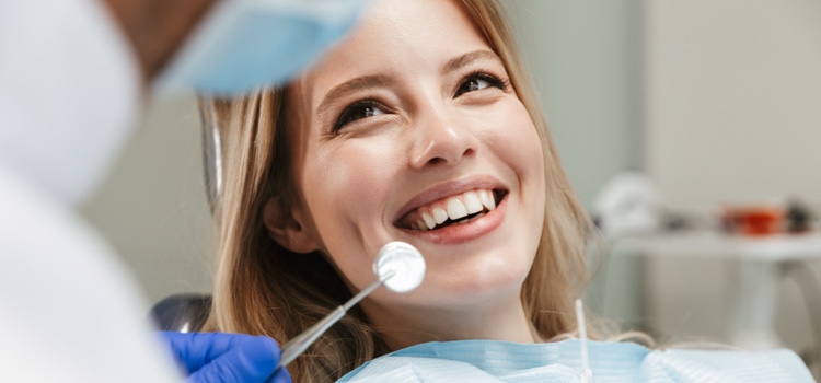 Dental professional with patient consulting their oral health