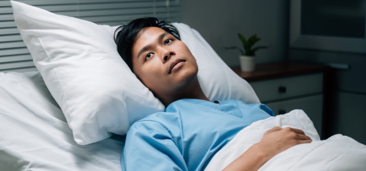 Dental patient in bed recovering after procedure
