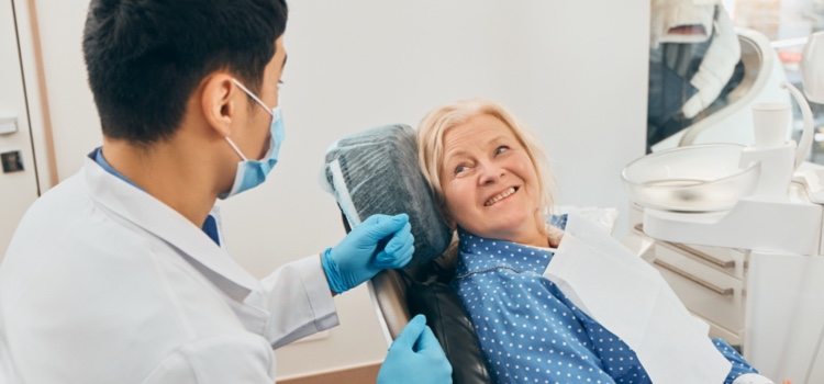 Dental professional consulting with patient