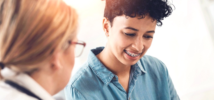 Dentist consulting patient on treatments and recovery