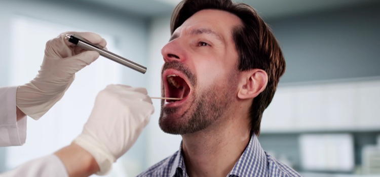 Male patient being examined at the dentist.