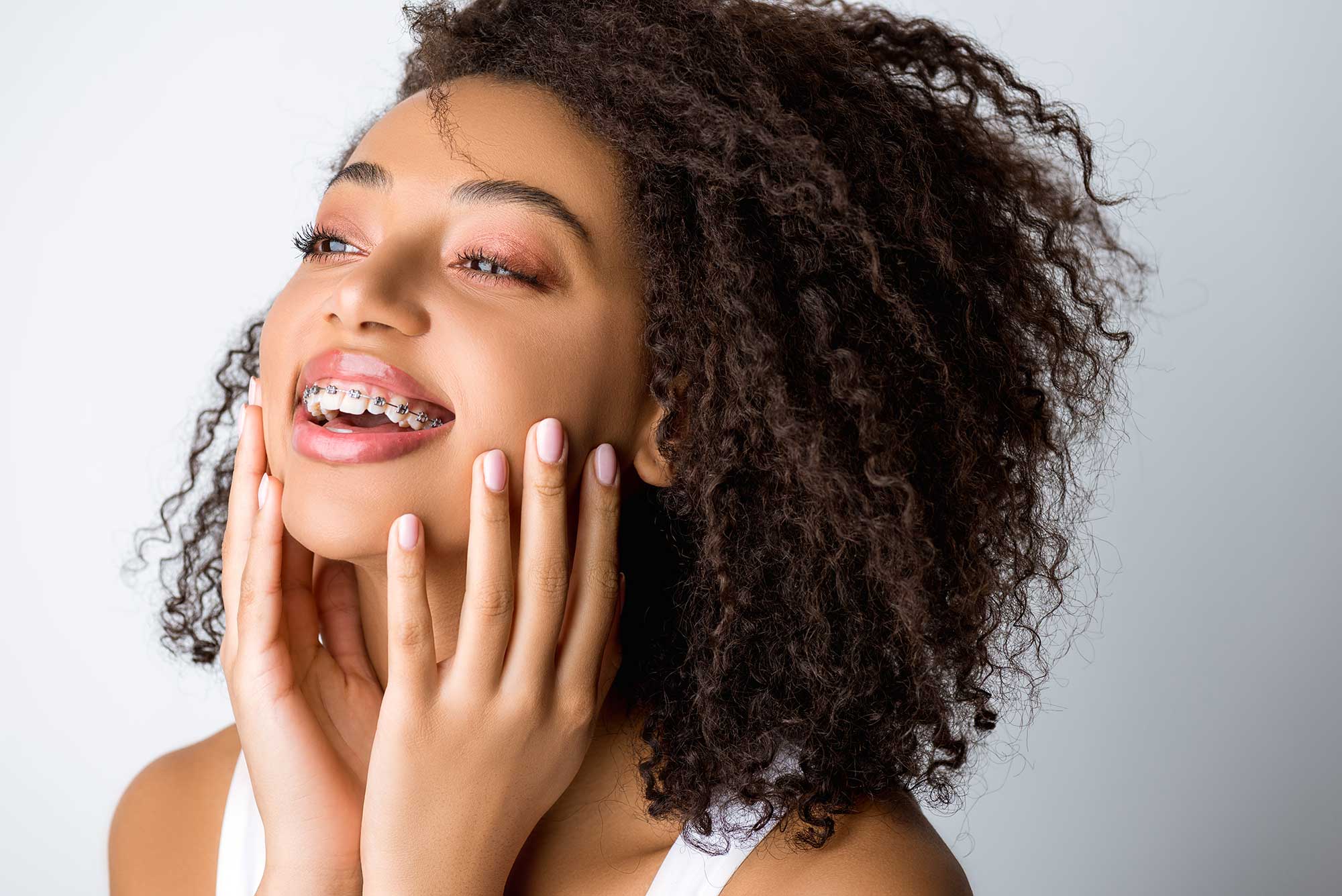Woman proudly showing off her braces